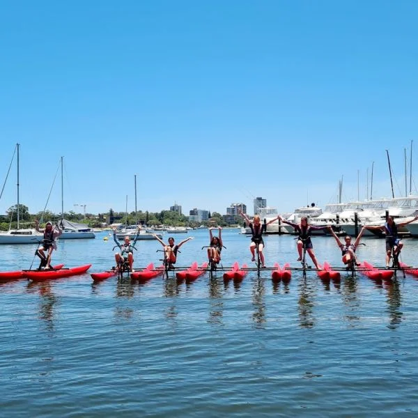 group posiing for photo on water bikes in crawley