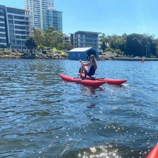 young lady enjoying matilda bay on a waterbike